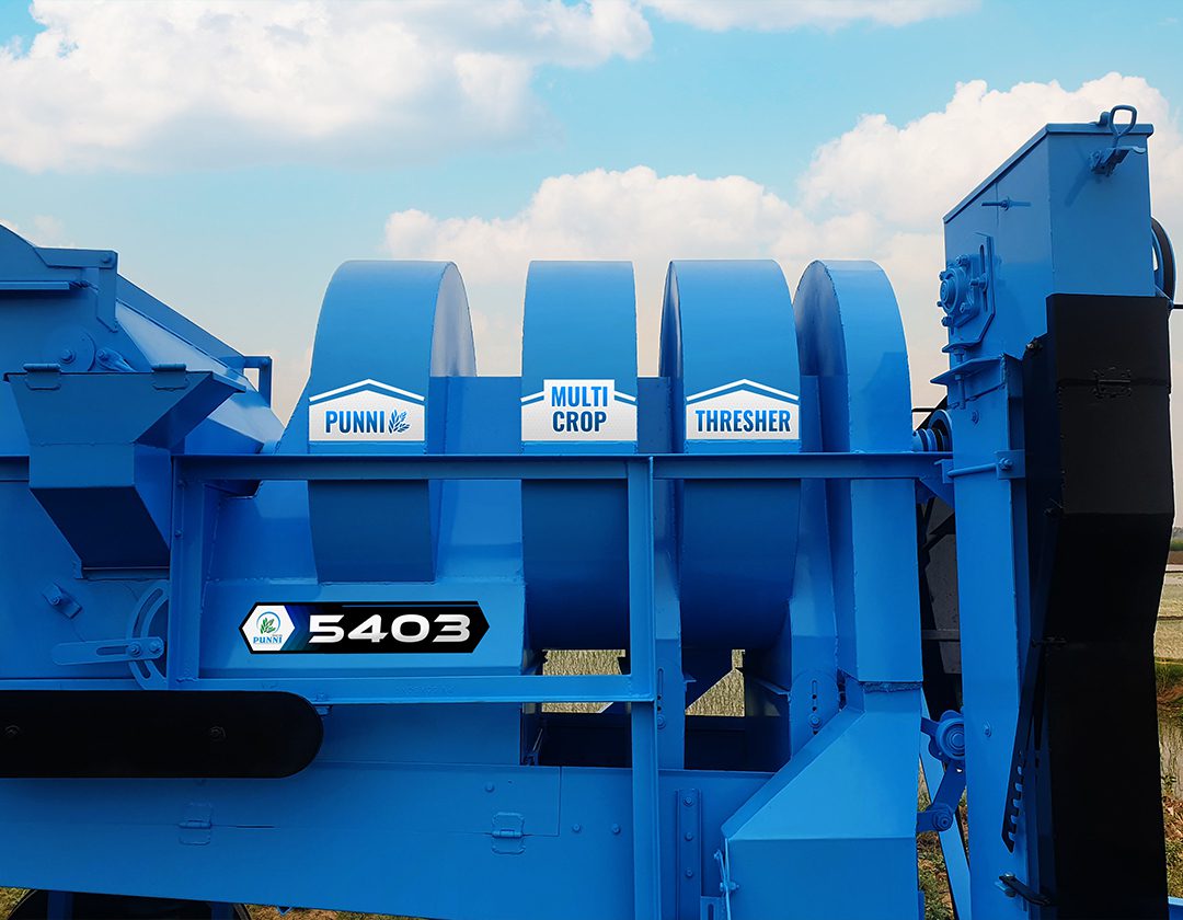A detailed image of the side of the PUNNI 5403 multi-crop thresher, showcasing its advanced features and robust construction.