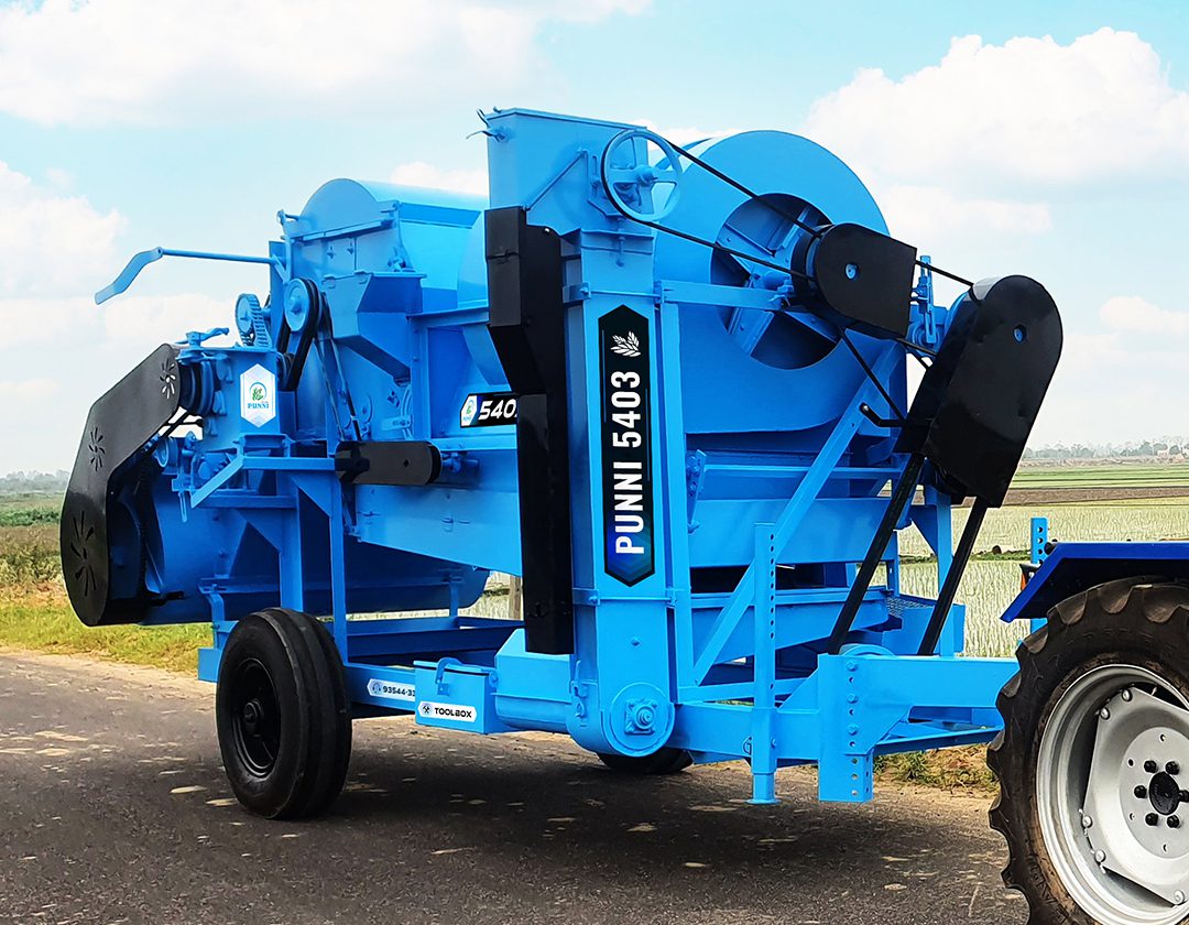 A close-up image of the front of the PUNNI 5403 multi-crop thresher, showcasing its advanced features and rugged construction.