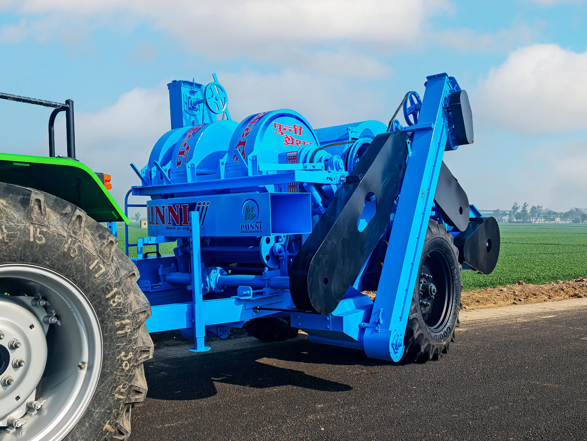 multi-crop thresher with tractor attachment, front view.