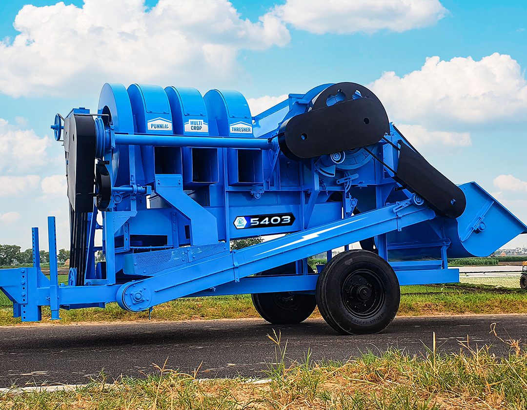 A detailed image of the PUNNI 5403 multi-crop thresher from a different angle, highlighting its rugged construction and advanced features.