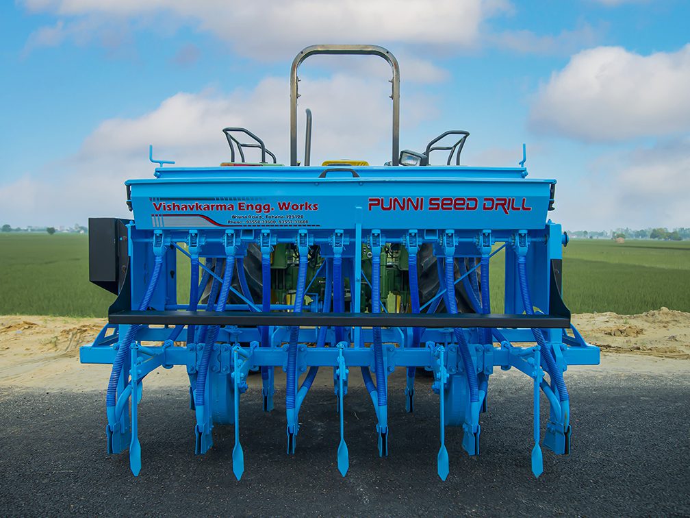 PUNNI Zero drill attached to a tractor, back side view, showing all parts