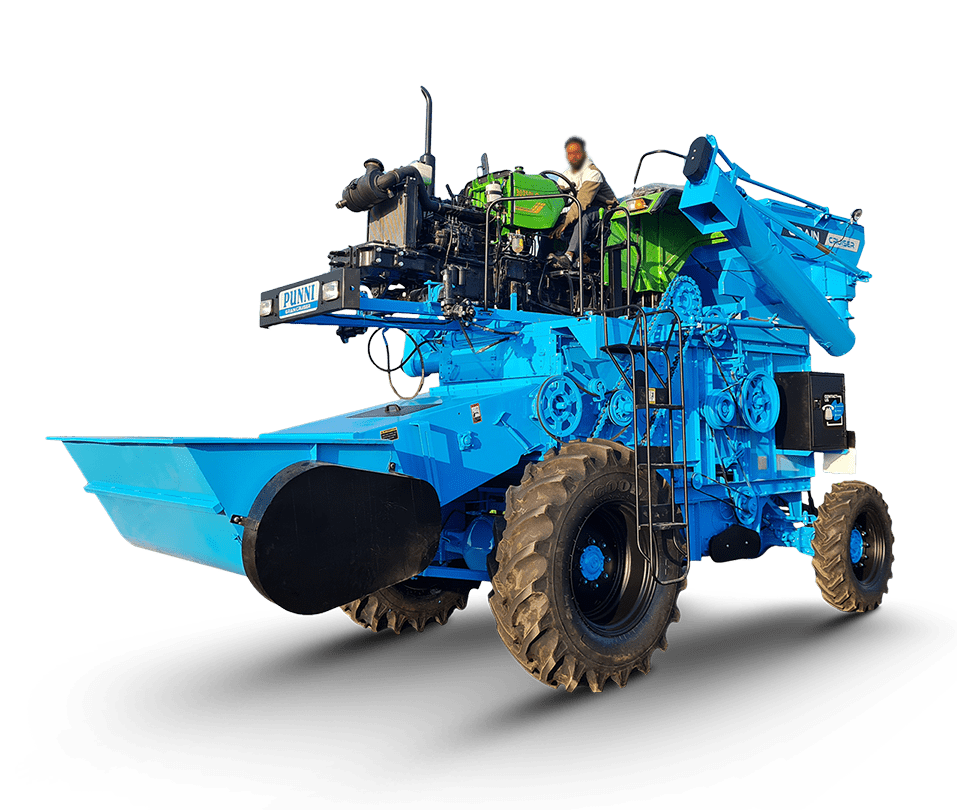 Front view of Punni Tractor Mounted Combine Harvester harvesting wheat in an open field.